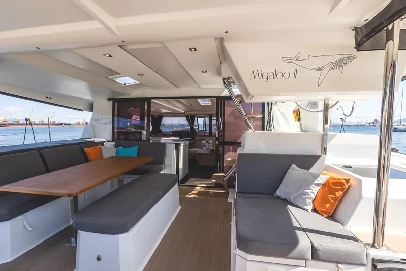  Yacht Photos Pics Luxurious 2023 Fountaine Pajot Astrea 42 Maestro yacht interior with elegant seating and ocean view.