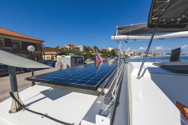  Yacht Photos Pics 2023 Fountaine Pajot Astrea 42 Maestro catamaran with solar panels docked at marina.