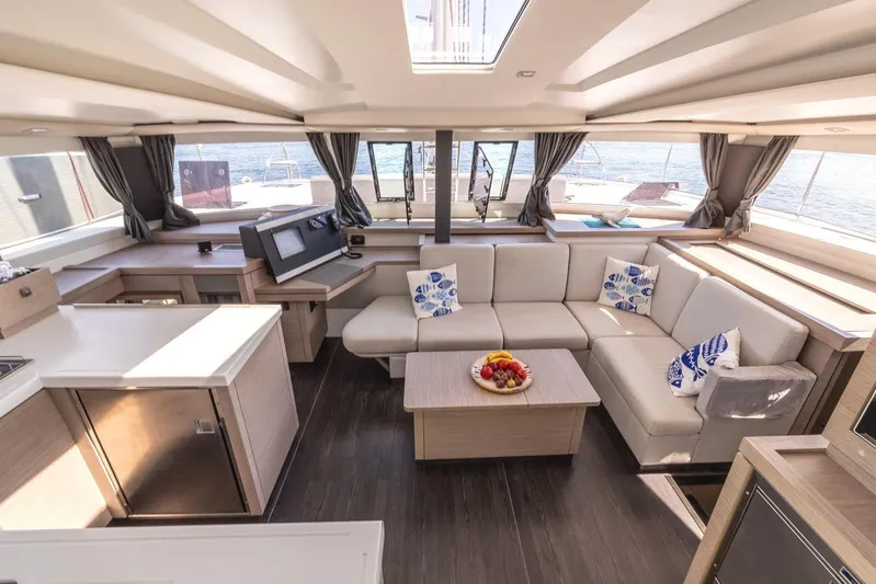  Yacht Photos Pics Luxurious interior of 2023 Fountaine Pajot Astrea 42 Maestro catamaran with modern furnishings.
