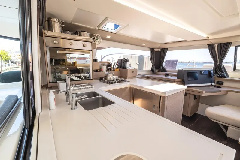  Yacht Photos Pics Modern kitchen interior of 2023 Fountaine Pajot Astrea 42 Maestro catamaran.