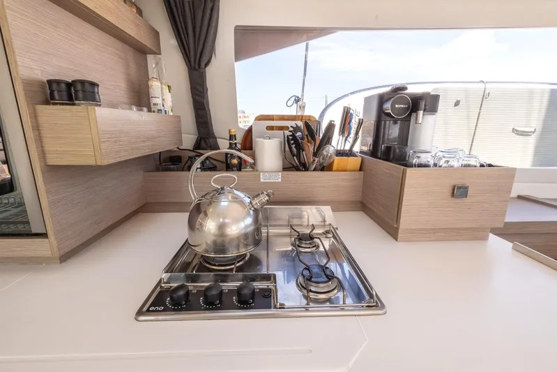  Yacht Photos Pics Modern kitchen in 2023 Fountaine Pajot Astrea 42 Maestro yacht with stove and appliances.