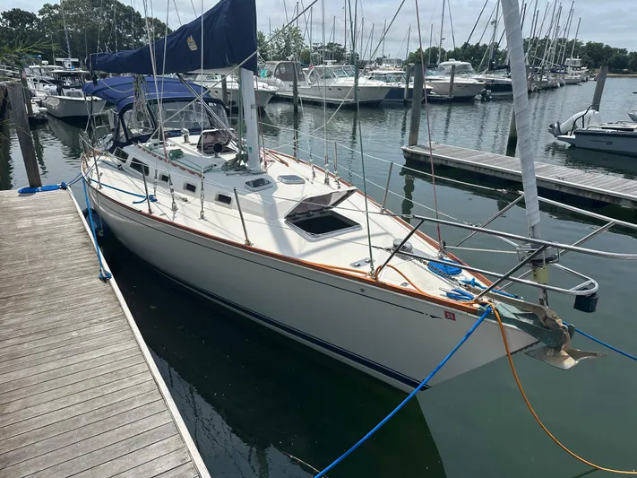 Hawk Yacht Photos Pics 1987 Sabre 42 sailboat docked at marina, featuring sleek design and spacious deck.