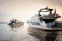 Luxury yachts on water, featuring 2025 Super Lauwersmeer SLX54 model, under a serene sky.