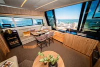Luxurious interior of 2025 Super Lauwersmeer SLX54 yacht with modern kitchen and dining area.