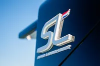 Super Lauwersmeer SLX54 2025 logo on sleek blue surface, showcasing modern design.
