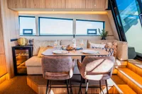 Luxurious interior of 2025 Super Lauwersmeer SLX54 yacht with elegant dining area.