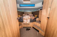 Luxurious cabin interior of 2025 Super Lauwersmeer SLX54 yacht with cozy bedding.