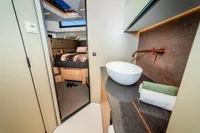 Luxurious interior of 2025 Super Lauwersmeer SLX54 yacht with modern bathroom and cozy bedroom.