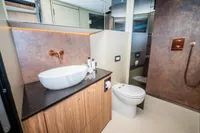 Luxurious bathroom in 2025 Super Lauwersmeer SLX54 yacht with modern fixtures and elegant design.