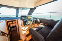 Interior of 2025 Super Lauwersmeer SLX54 yacht, featuring helm station and luxurious seating.