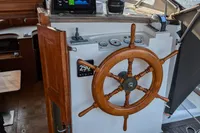 1984 Island Trader 40 sailboat helm with wooden wheel and navigation instruments.