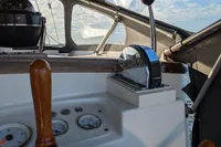 1984 Island Trader 40 sailboat cockpit with wooden wheel and control panel.