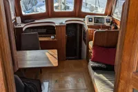 Interior of 1984 Island Trader 40 sailboat with wood finish and seating area.