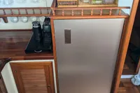 1984 Island Trader 40 yacht kitchen with wooden cabinets and modern appliances.