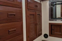 1984 Island Trader 40 interior with wooden cabinets and parquet flooring.