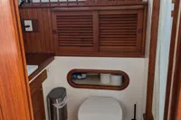 1984 Island Trader 40 bathroom with wooden accents and nautical decor.