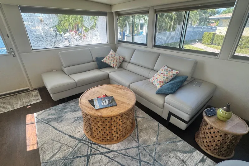 Music Yacht Photos Pics Luxurious interior of 1989 Hatteras 65 Motor Yacht with modern seating and decor.