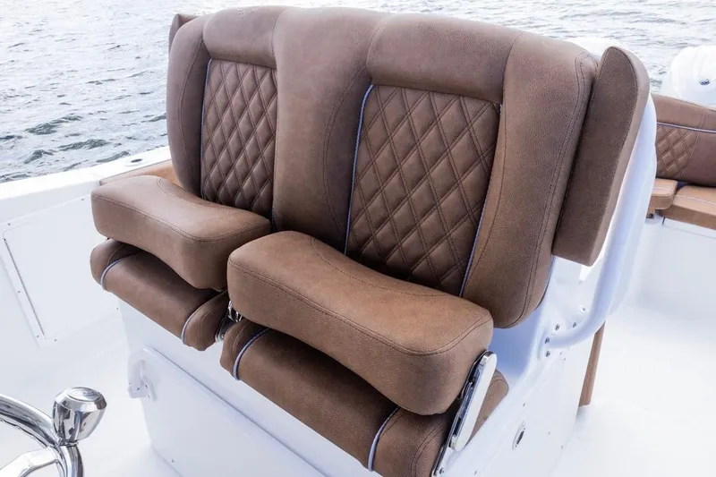  Yacht Photos Pics Luxurious brown seating on 2026 Sea Hunt Ultra 275 SE boat, featuring diamond stitching.