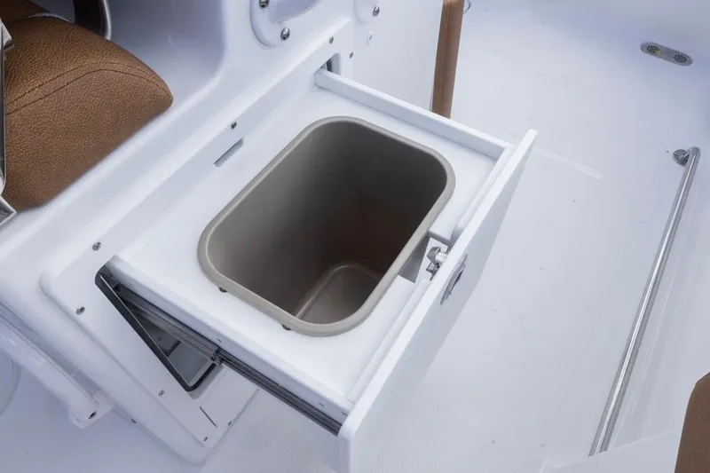  Yacht Photos Pics 2026 Sea Hunt Ultra 275 SE boat with open storage compartment and brown seating.