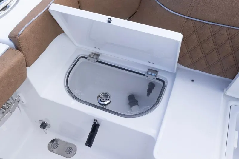  Yacht Photos Pics Livewell compartment on 2026 Sea Hunt Ultra 275 SE boat, featuring cushioned seating.