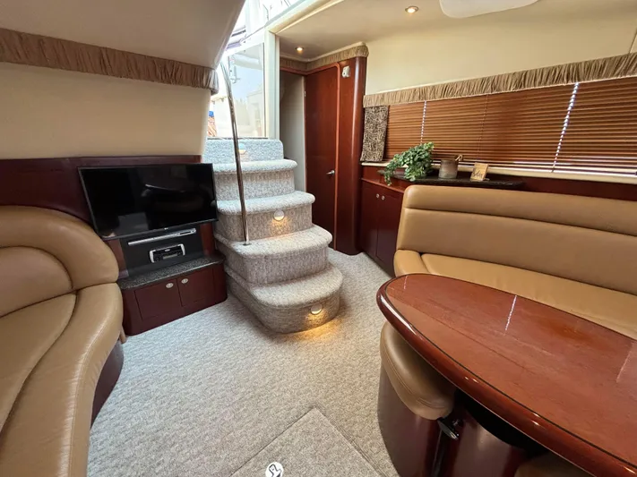 Tre Bella Yacht Photos Pics Luxurious interior of 2005 Sea Ray 390 Motor Yacht with plush seating and elegant decor.