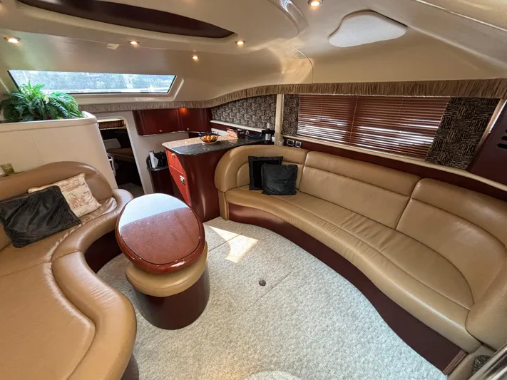 Tre Bella Yacht Photos Pics Luxurious interior of a 2005 Sea Ray 390 Motor Yacht with plush seating and elegant decor.