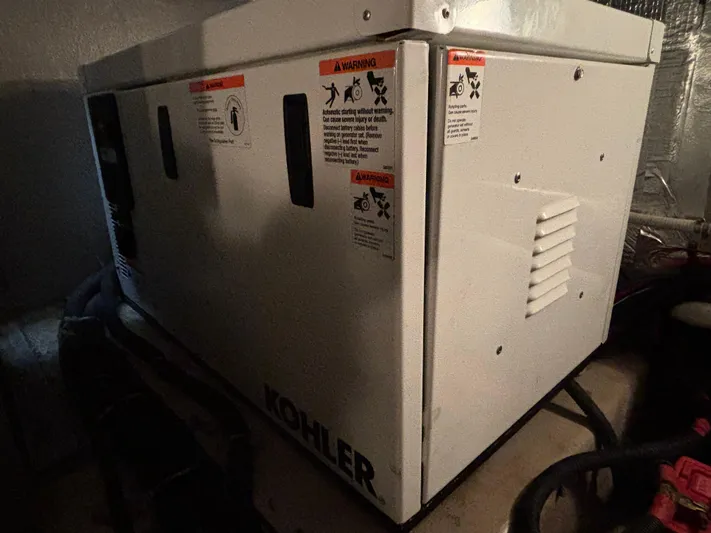Tre Bella Yacht Photos Pics Kohler generator in a 2005 Sea Ray 390 Motor Yacht engine room.