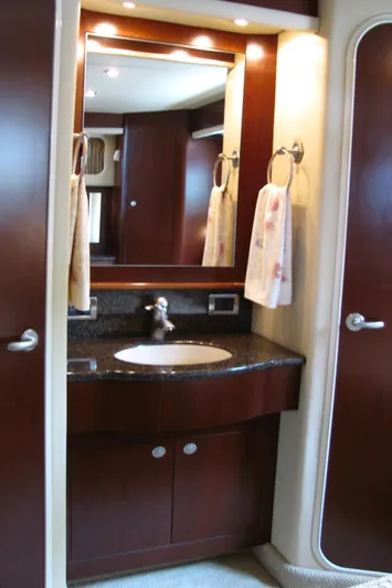 Tre Bella Yacht Photos Pics Luxurious bathroom in 2005 Sea Ray 390 Motor Yacht with elegant wood finish.