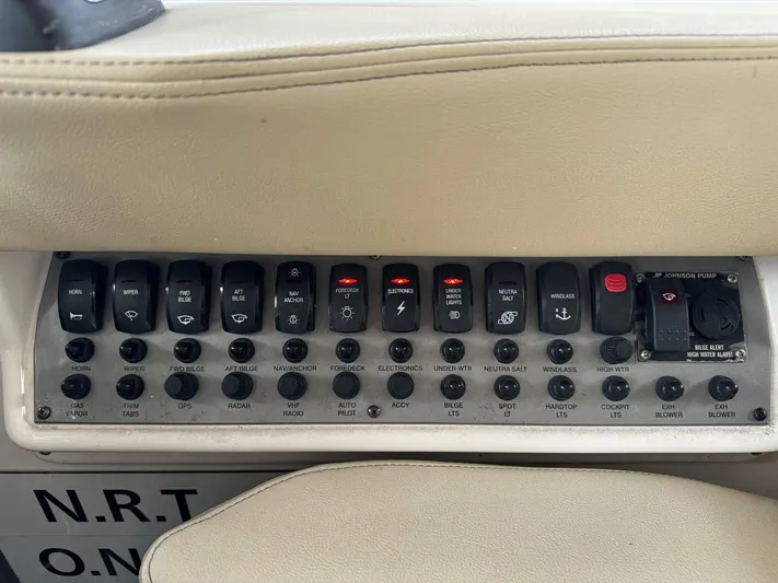 Clintessa Yacht Photos Pics Control panel of a 2012 Regal 35 Sport Coupe boat with labeled switches.