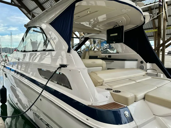 Clintessa Yacht Photos Pics 2012 Regal 35 Sport Coupe yacht docked in a marina, showcasing sleek design and luxury features.