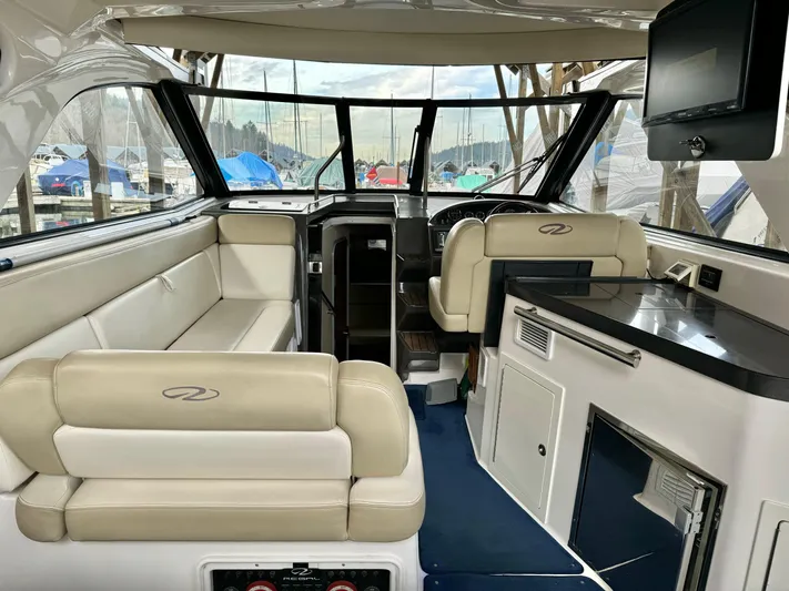 Clintessa Yacht Photos Pics Interior of 2012 Regal 35 Sport Coupe with beige seating and modern amenities.
