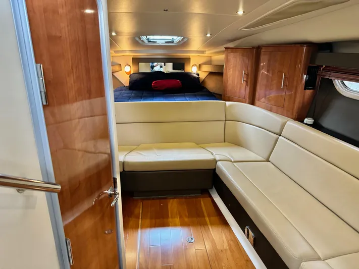 Clintessa Yacht Photos Pics Luxurious interior of 2012 Regal 35 Sport Coupe with leather seating and wood accents.