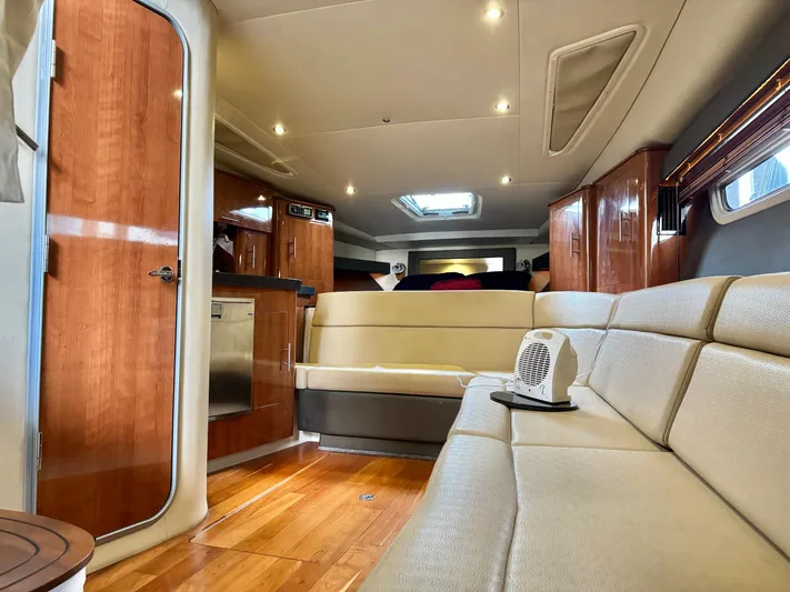 Clintessa Yacht Photos Pics Interior of 2012 Regal 35 Sport Coupe yacht with modern furnishings and wood accents.