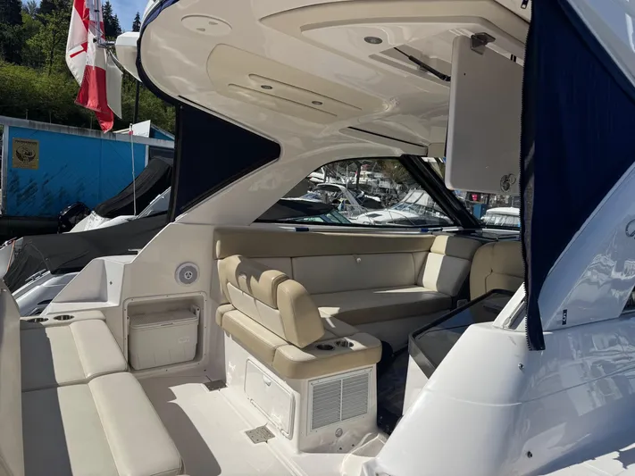 Clintessa Yacht Photos Pics 2012 Regal 35 Sport Coupe interior with beige seating and modern design.