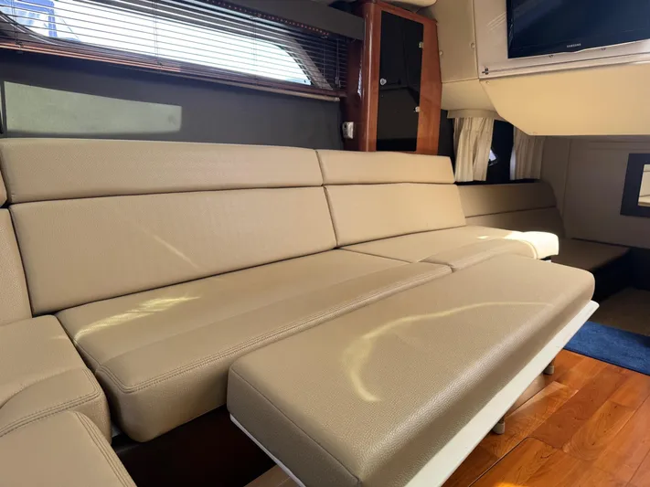 Clintessa Yacht Photos Pics Luxurious interior of 2012 Regal 35 Sport Coupe with beige leather seating.