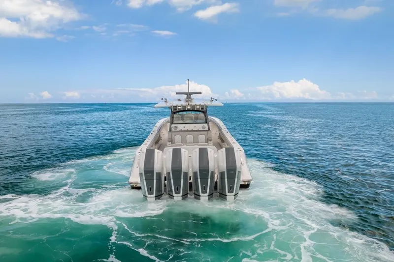  Yacht Photos Pics 2023 HCB 53 Sueños luxury boat cruising on open ocean waters.