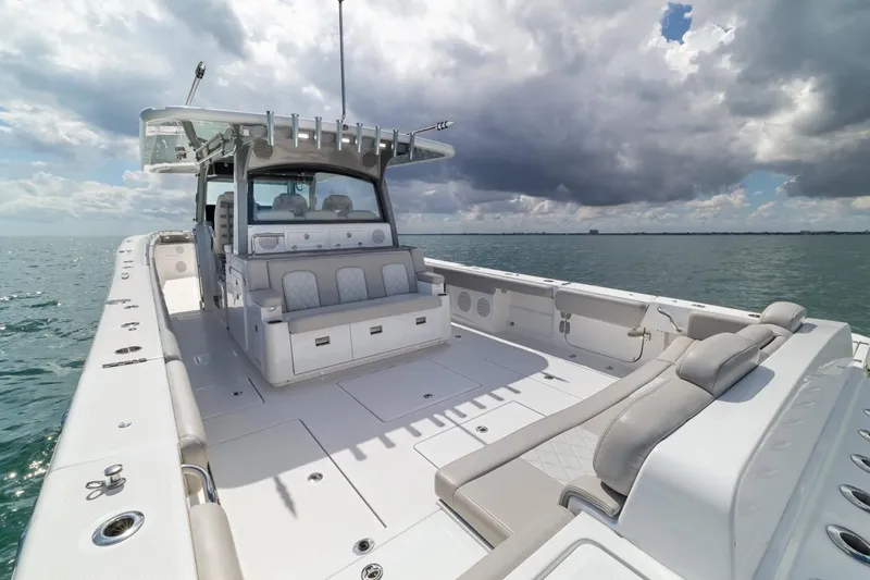  Yacht Photos Pics 2023 HCB 53 Sueños luxury boat on open water under cloudy sky.