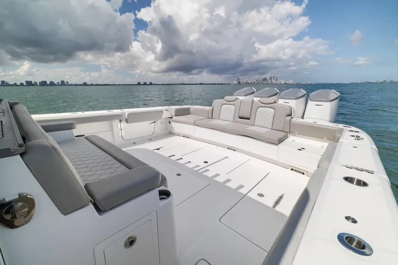  Yacht Photos Pics 2023 HCB 53 Sueños luxury boat with spacious seating, ocean view, and city skyline.