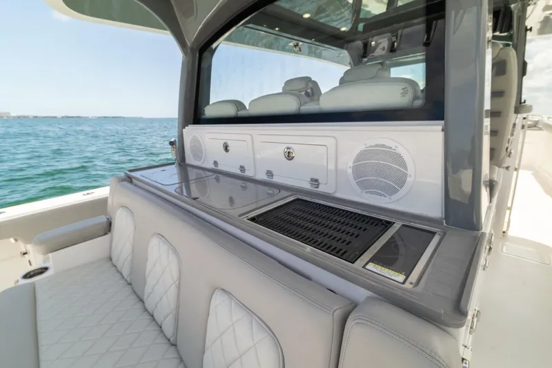  Yacht Photos Pics Luxury seating and grill area on 2023 HCB 53 Sueños boat.