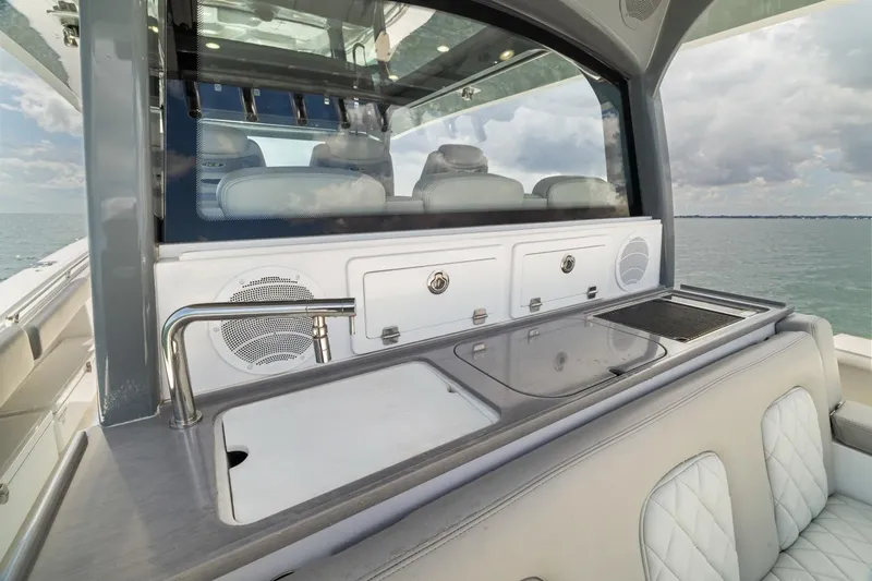  Yacht Photos Pics Luxury yacht HCB 53 Sueños 2023 with sleek outdoor kitchen and ocean view.