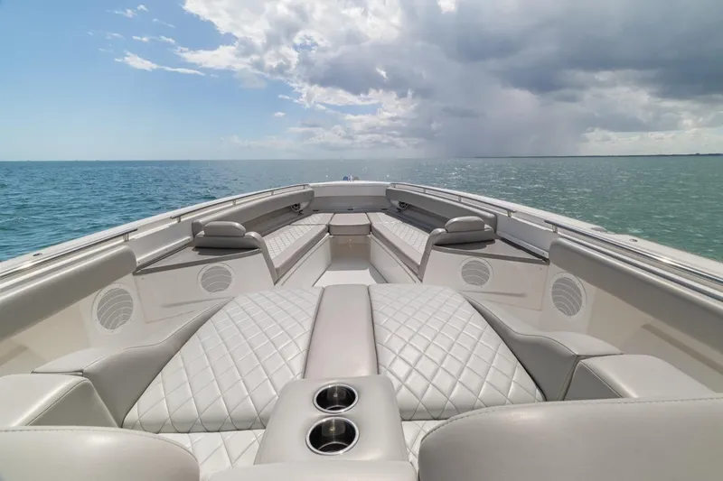  Yacht Photos Pics Luxurious 2023 HCB 53 Sueños boat interior with quilted seating on open water.