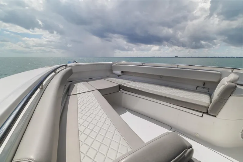  Yacht Photos Pics Luxurious seating on 2023 HCB 53 Sueños yacht under cloudy sky.