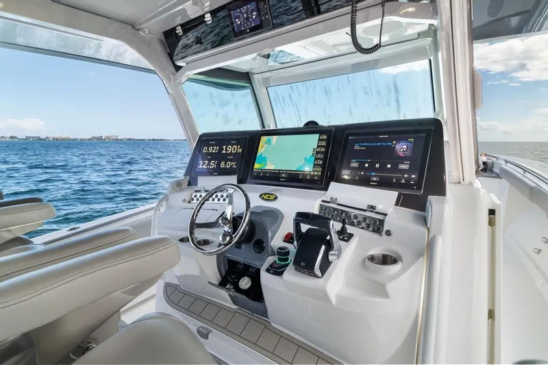  Yacht Photos Pics 2023 HCB 53 Sueños boat cockpit with advanced navigation and control systems.