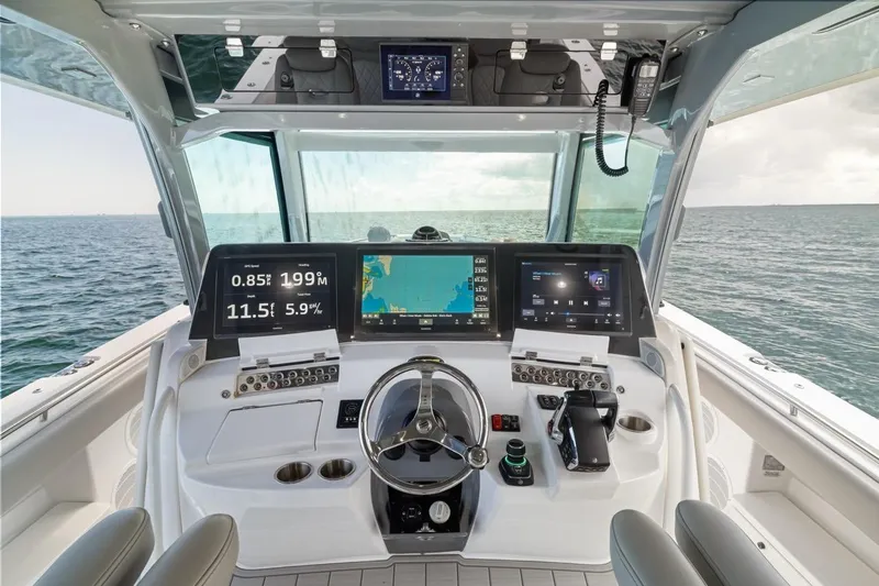  Yacht Photos Pics Helm of 2023 HCB 53 Sueños boat with advanced navigation displays.