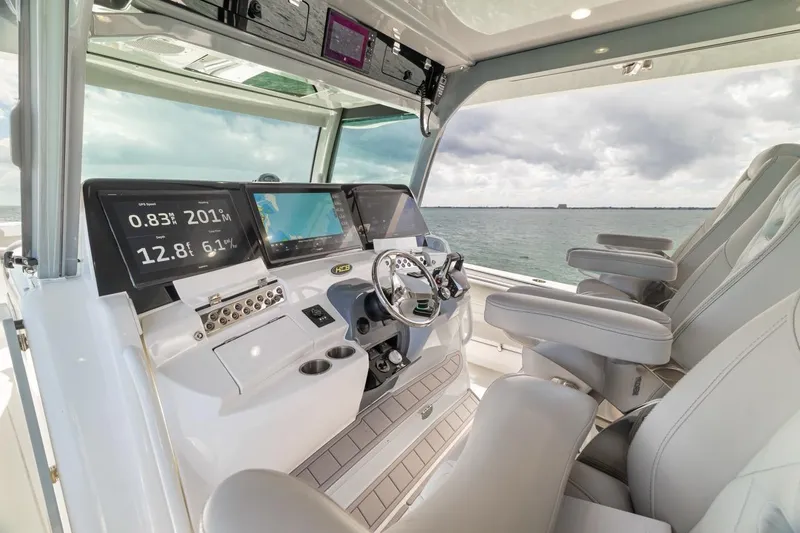  Yacht Photos Pics Interior of 2023 HCB 53 Sueños boat with advanced navigation system and luxurious seating.