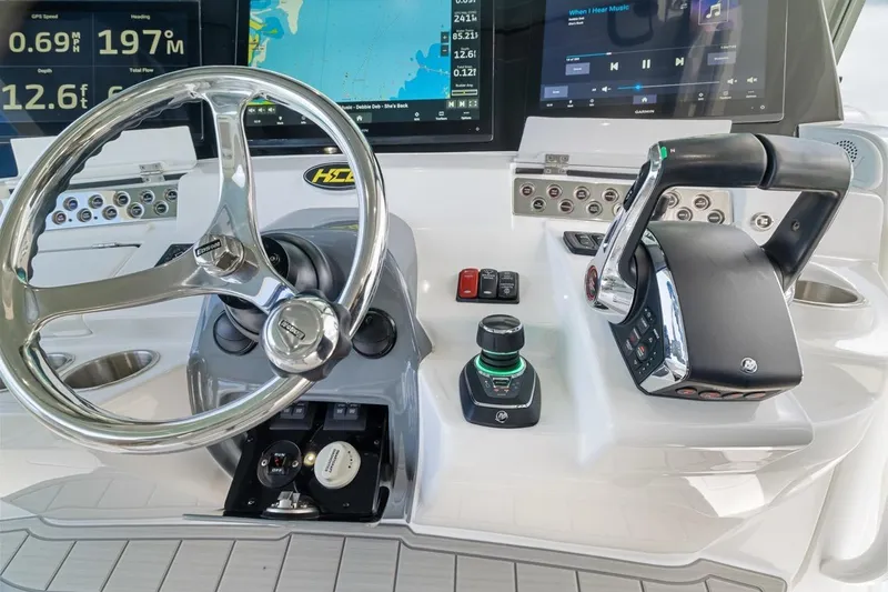  Yacht Photos Pics 2023 HCB 53 Sueños helm with advanced controls and navigation displays.