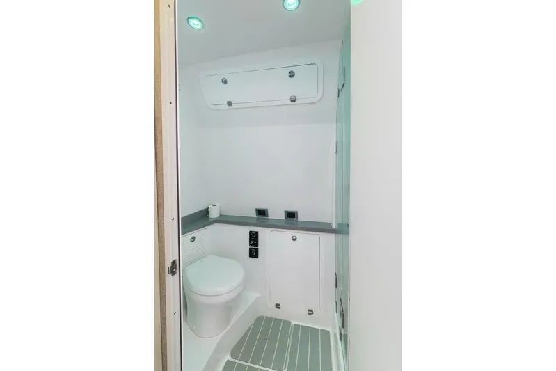  Yacht Photos Pics Modern bathroom interior in 2023 HCB 53 Sueños boat, featuring sleek design and lighting.