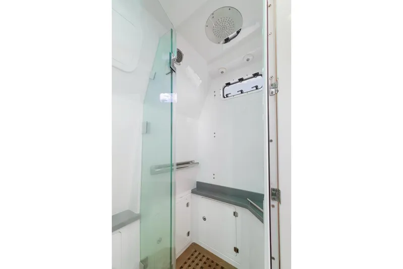  Yacht Photos Pics Modern shower area in 2023 HCB 53 Sueños boat with glass door and sleek design.