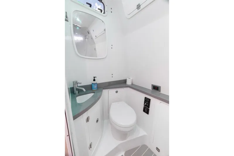  Yacht Photos Pics Modern bathroom in 2023 HCB 53 Sueños boat, featuring sleek design and compact amenities.