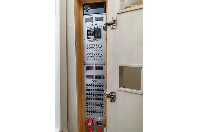 Yacht Photos Pics Electrical control panel inside 2023 HCB 53 Sueños boat, featuring various switches and displays.